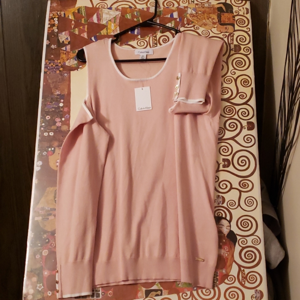 Pale pink, cold shoulder sweater with white trim